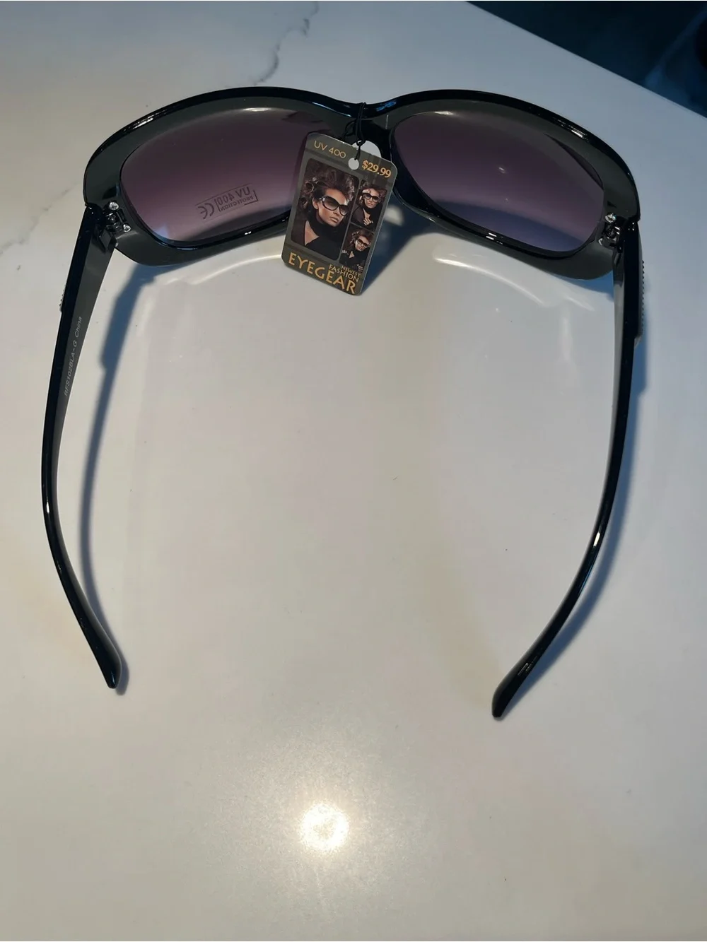 NWT fabulous oversized black sunglasses with gold tone design on front & sides.